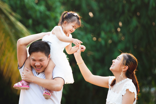 asian-family-father-mother-daughter-playing-together-park-with-love-happiness_7186-2612
